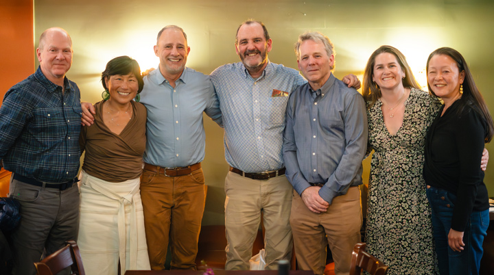 Family owner, Zac, poses with members of The Nature Conservancy